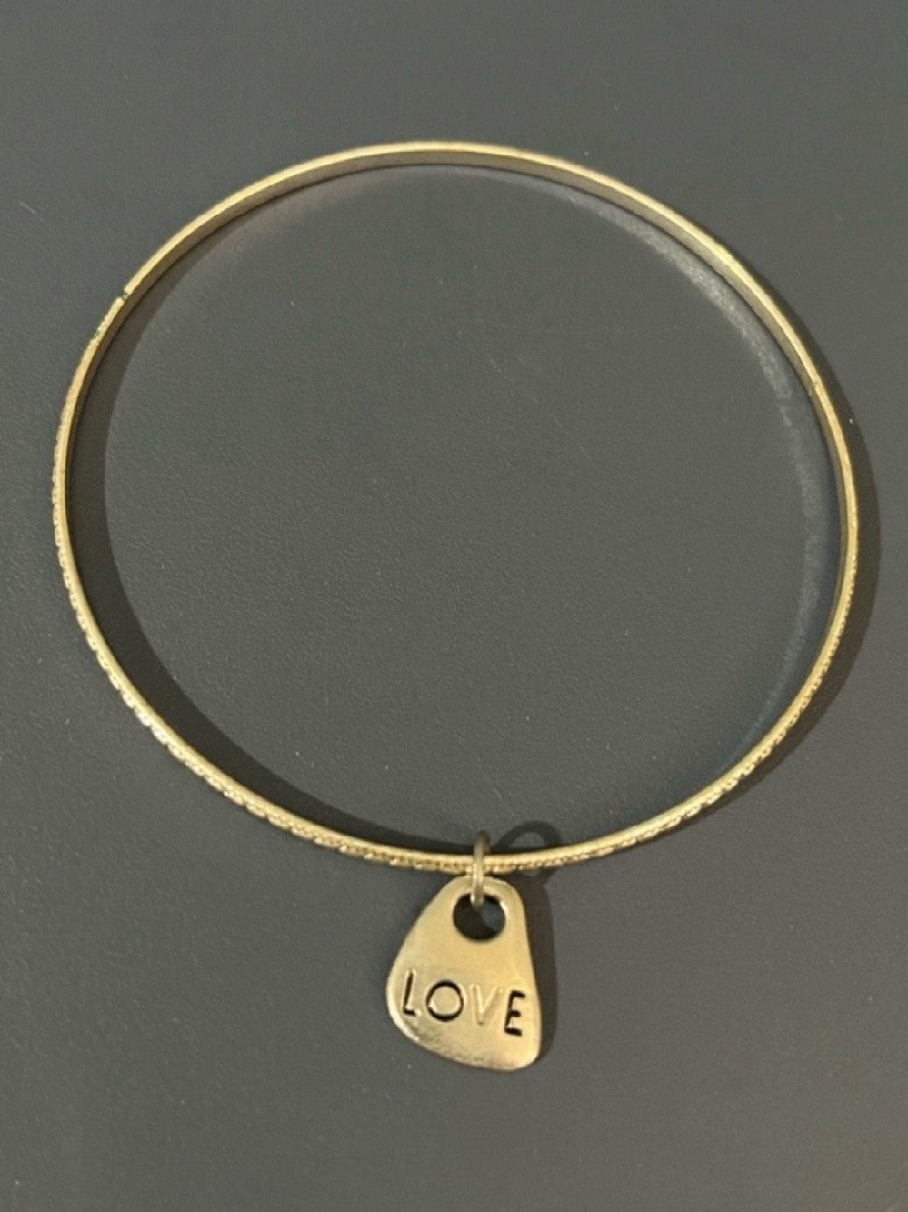 FREE w/ $10+ PURCHASE: “LOVE” Charm Silver Bangle